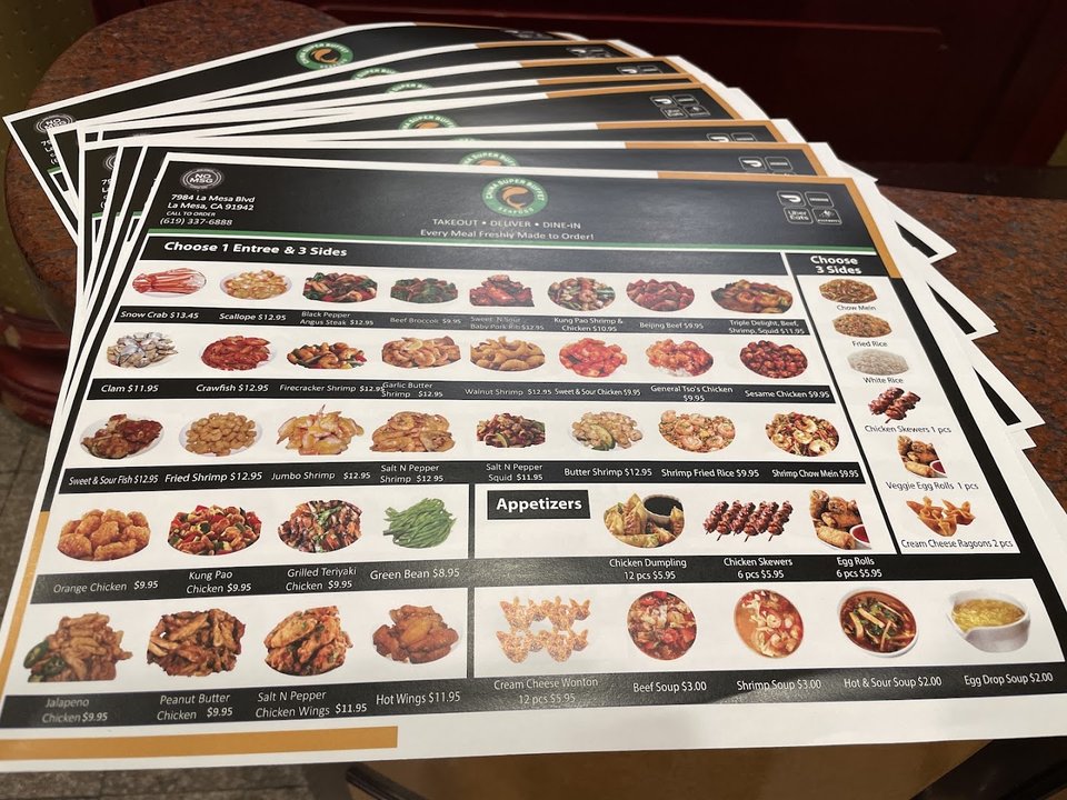 Buffet trays with Chinese dishes and sushi.